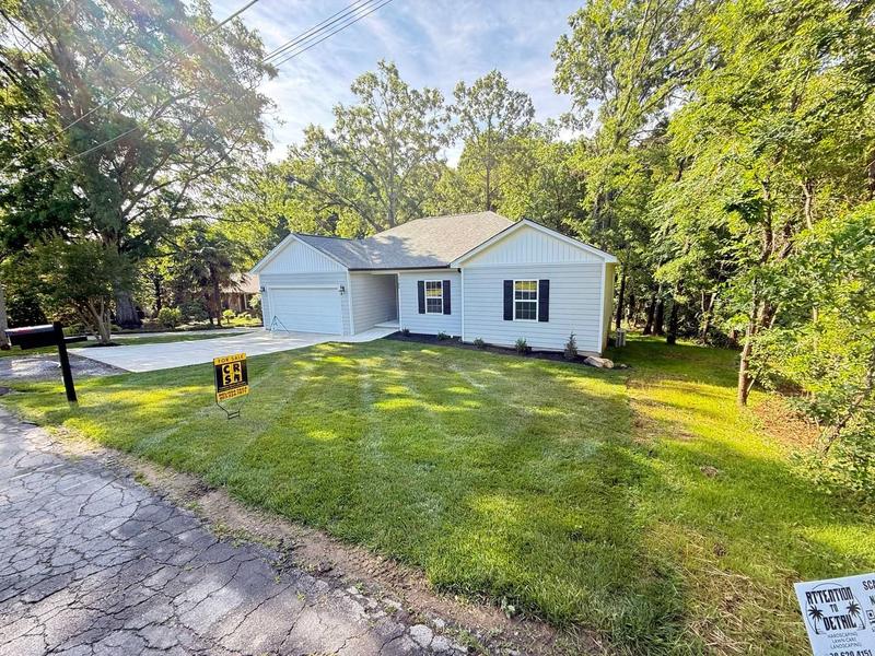 Freshly cut lawn at a home listed for sale